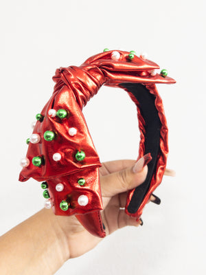 RED METALLIC SIDE BOW WITH GREEN AND WHITE BEADS HEADBAND