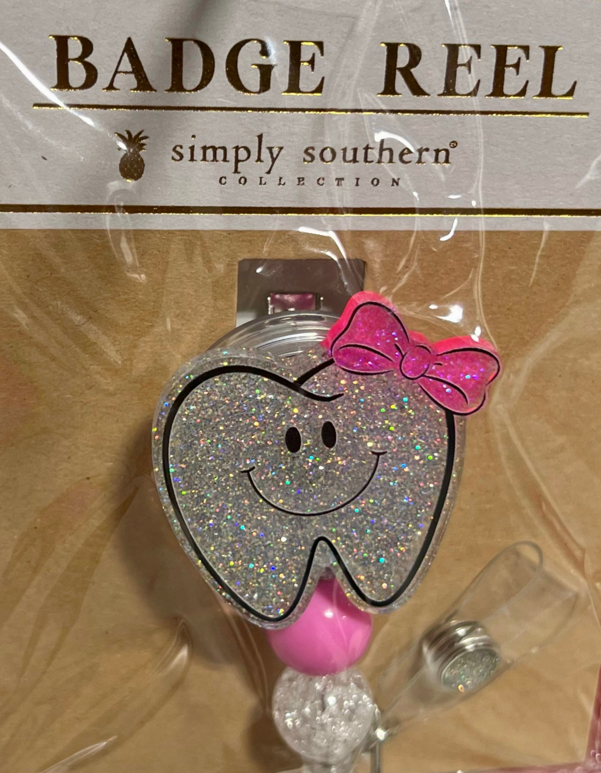 TOOTH BADGE REEL