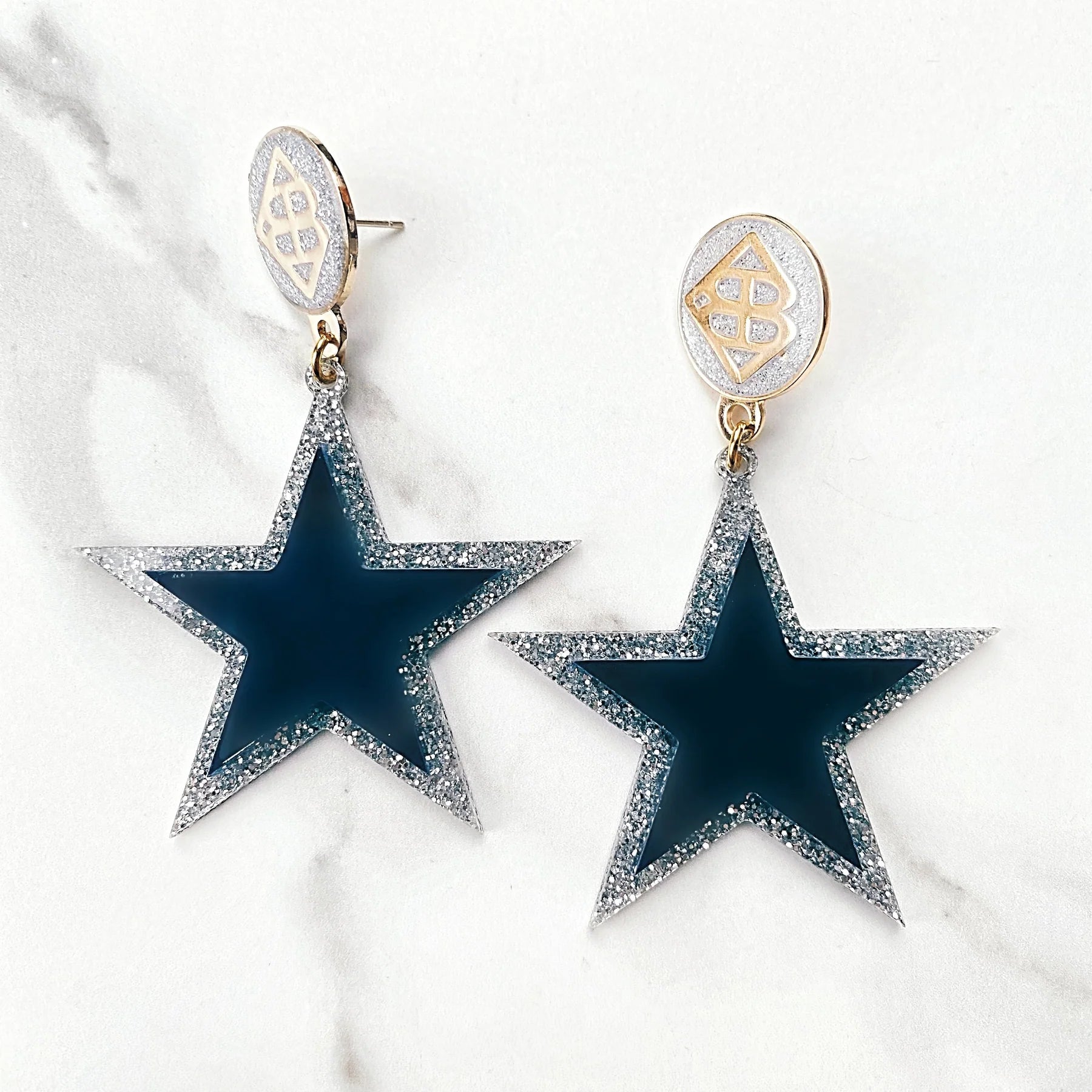 NAVY BLUE STAR EARRINGS OVER SILVER GLITTER WITH SILVER GLITTER LARGE BC LOGO TOP