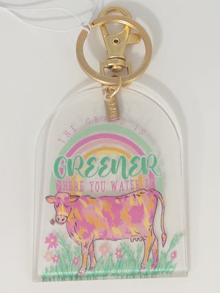 THE GRASS IS GREENER WHERE YOU WATER IT KEYCHAIN JANE MARIE